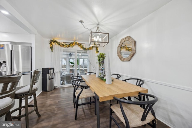 dining room featuring a chandelier and dark hardwood / wood-style flooring