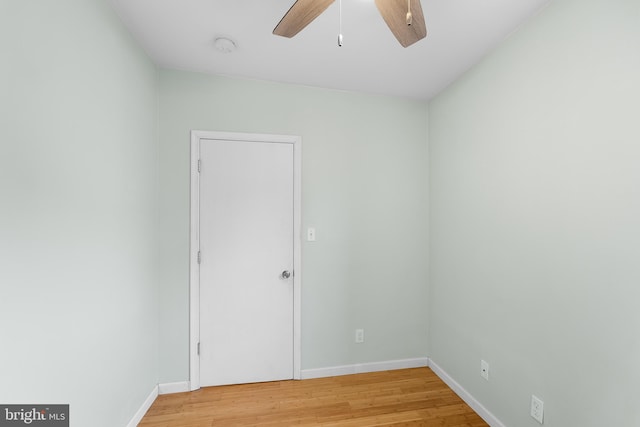 empty room featuring hardwood / wood-style flooring and ceiling fan