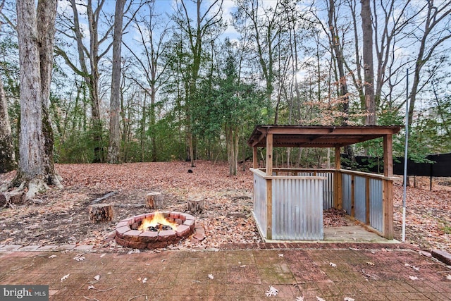 view of yard with an outdoor fire pit