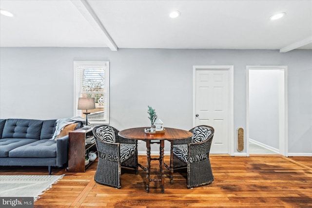 interior space featuring beam ceiling and hardwood / wood-style flooring