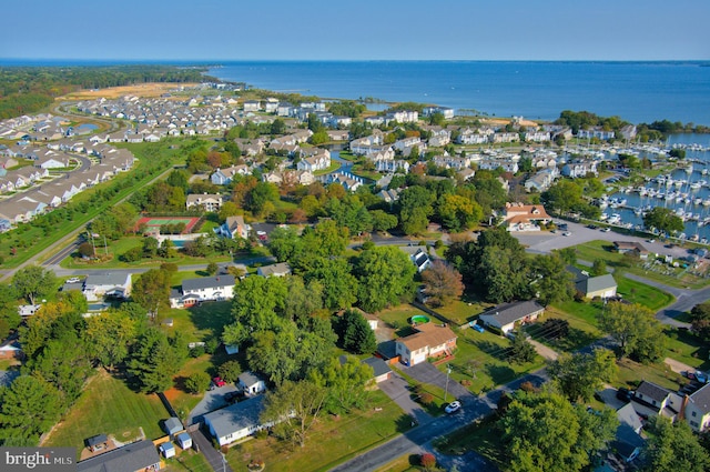 drone / aerial view with a water view and a residential view