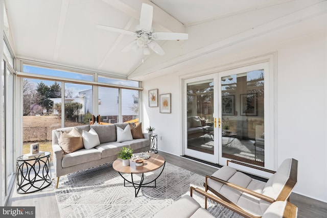 sunroom with lofted ceiling, ceiling fan, and french doors