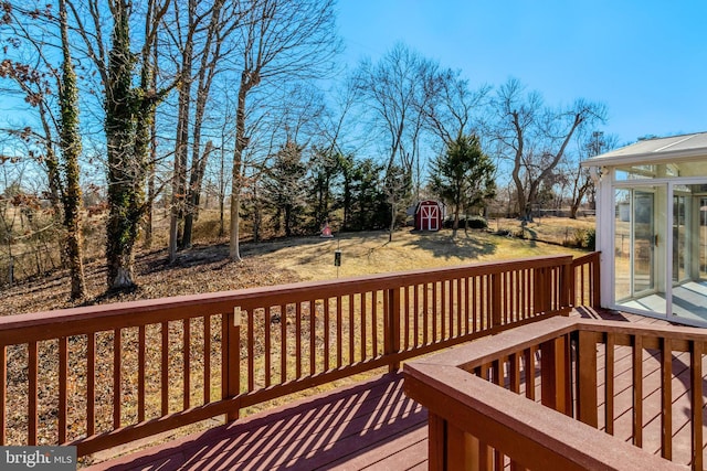 deck featuring an outbuilding and a shed