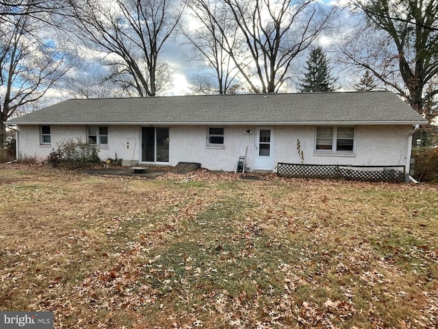 rear view of house with a lawn