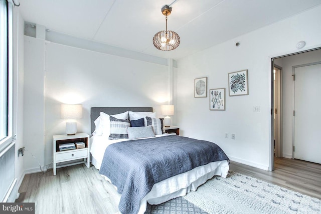 bedroom with hardwood / wood-style flooring