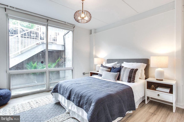 bedroom featuring light wood-type flooring