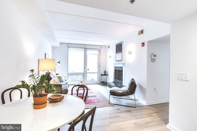 dining area with light hardwood / wood-style flooring