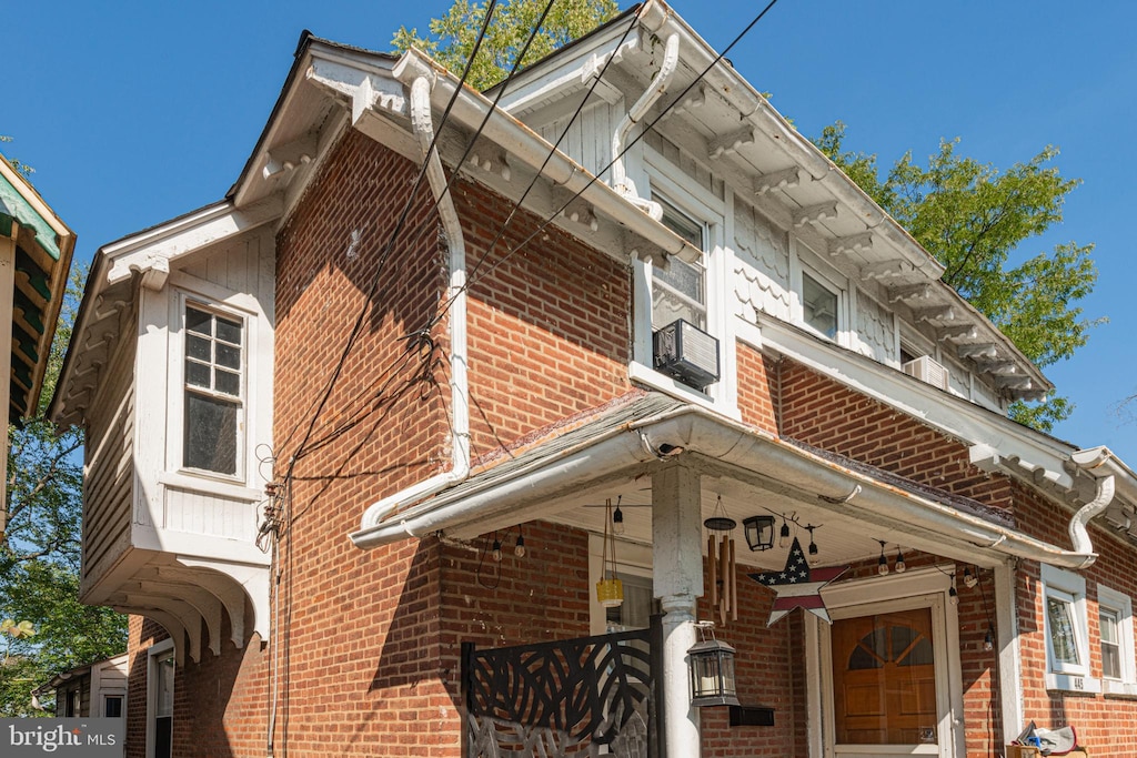 view of building exterior with cooling unit