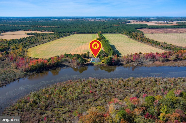 birds eye view of property featuring a rural view and a water view