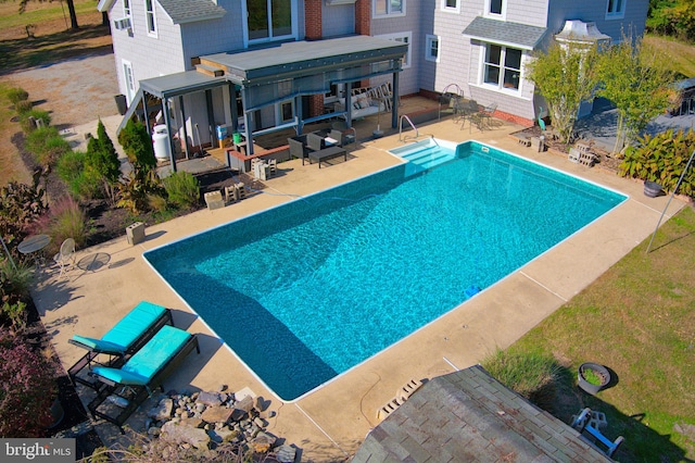 view of pool with a patio area