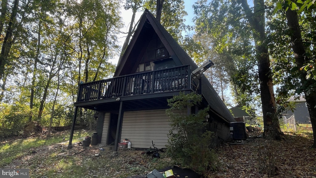 back of house with a wooden deck