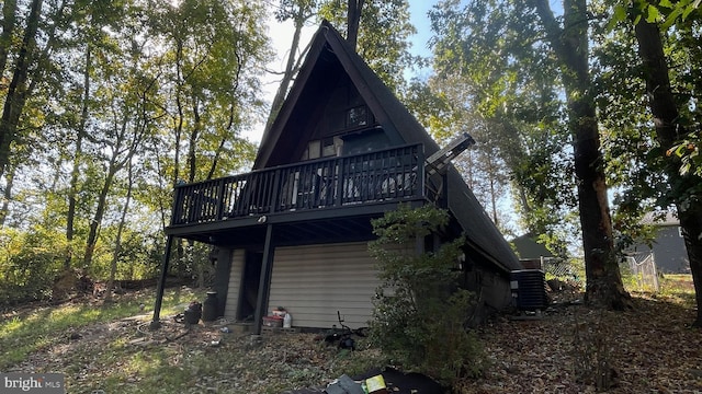 back of house with a wooden deck