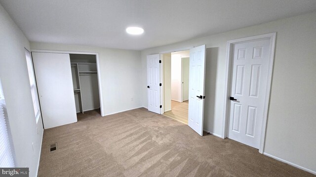 unfurnished bedroom with carpet flooring