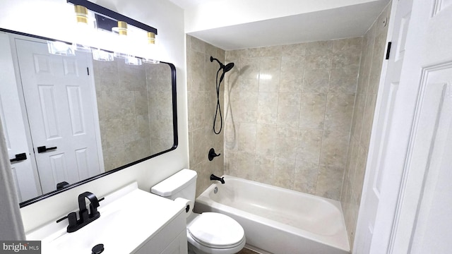 full bathroom with vanity, toilet, and tiled shower / bath