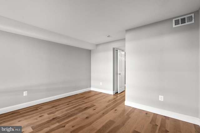 spare room featuring light wood-type flooring