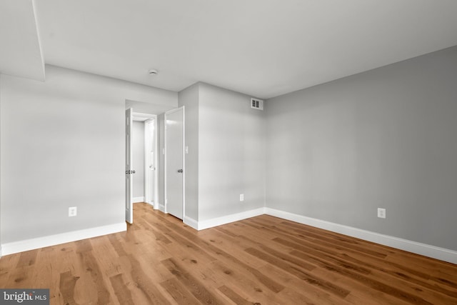 spare room featuring light hardwood / wood-style flooring