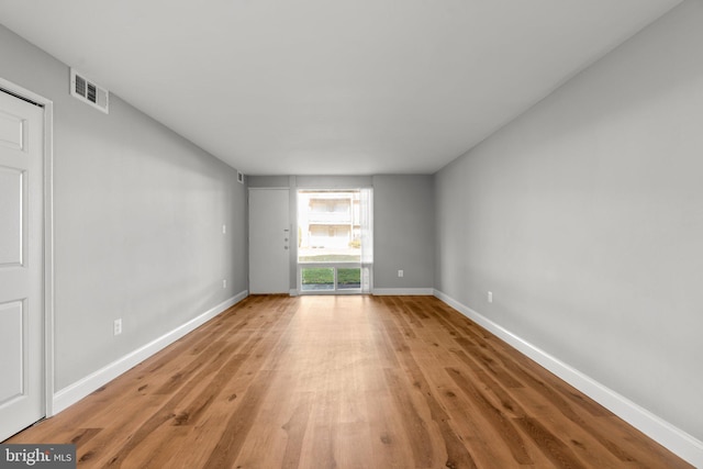 unfurnished room featuring light hardwood / wood-style flooring