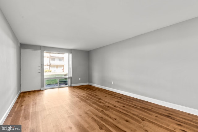 spare room featuring light wood-type flooring