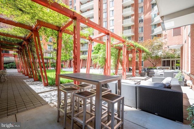 view of patio with a pergola and outdoor lounge area