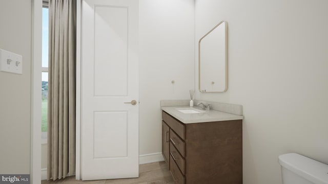 bathroom with vanity and toilet