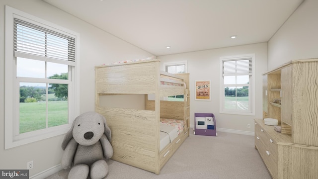 carpeted bedroom with multiple windows