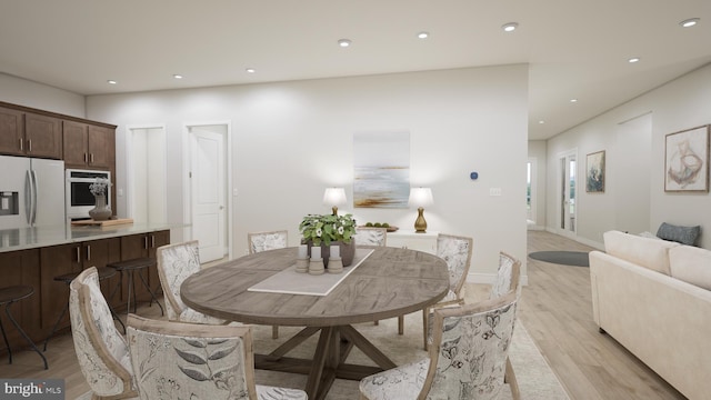 dining area with light wood-type flooring