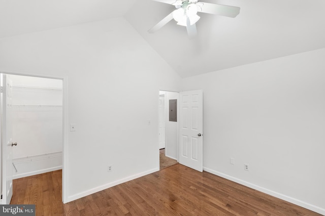 unfurnished bedroom featuring hardwood / wood-style floors, electric panel, a closet, and ceiling fan