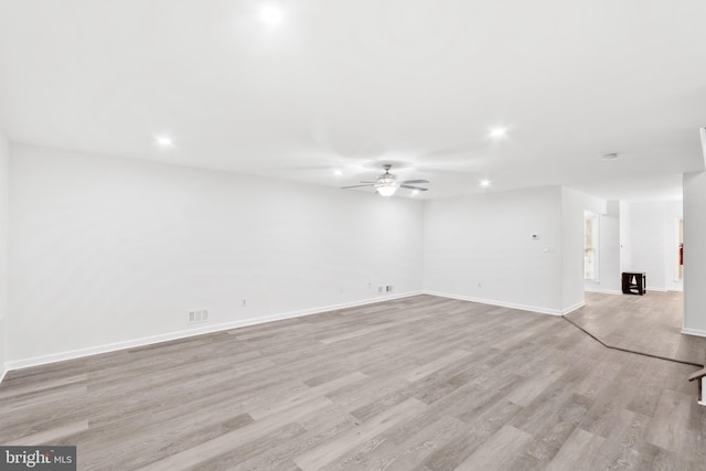 unfurnished room featuring ceiling fan and light hardwood / wood-style floors