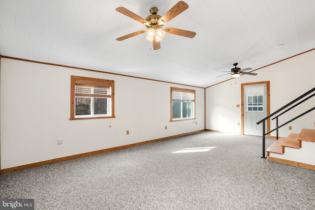 unfurnished living room featuring carpet flooring, ceiling fan, and ornamental molding