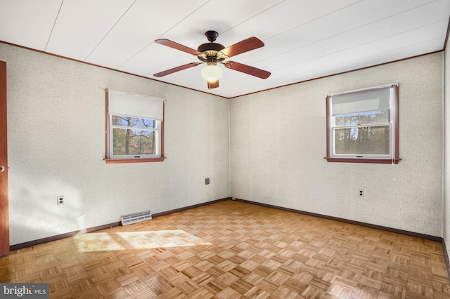 unfurnished room featuring light parquet flooring and ceiling fan