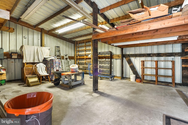 garage featuring wooden walls