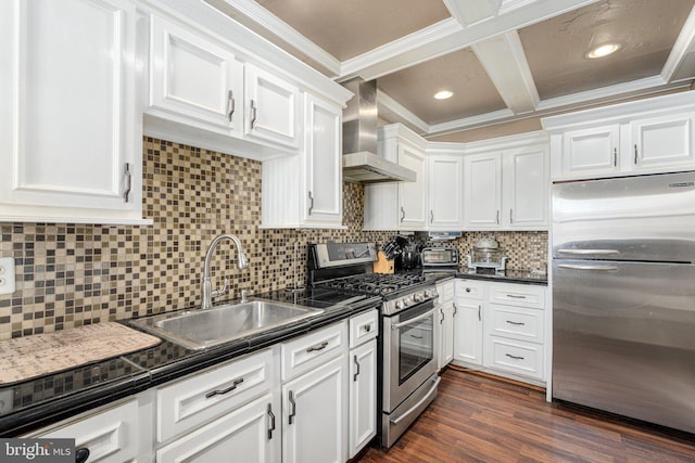 kitchen with backsplash, stainless steel appliances, sink, wall chimney range hood, and white cabinetry