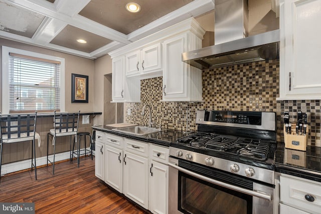 kitchen featuring white cabinetry, sink, wall chimney exhaust hood, stainless steel range with gas cooktop, and crown molding