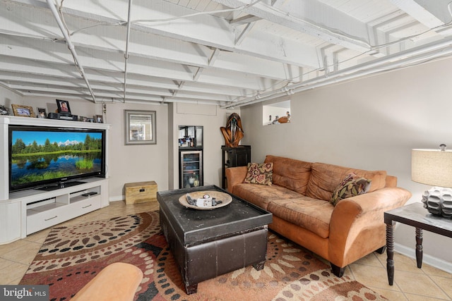 living room featuring tile patterned floors and beverage cooler