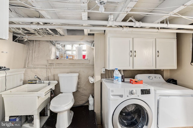 laundry room with sink and washing machine and clothes dryer