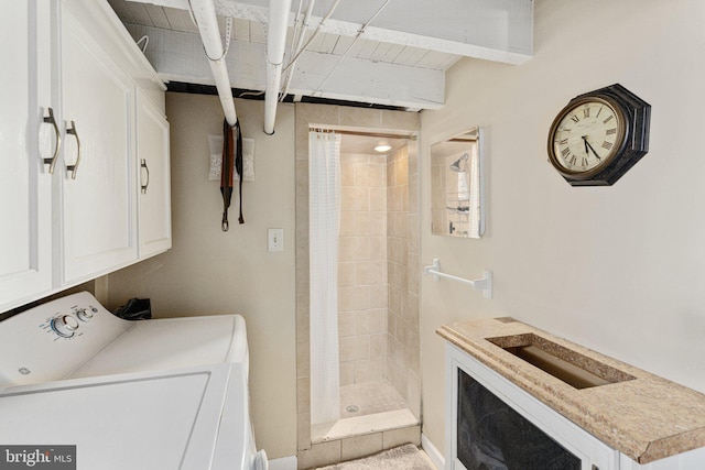 clothes washing area featuring washer and clothes dryer