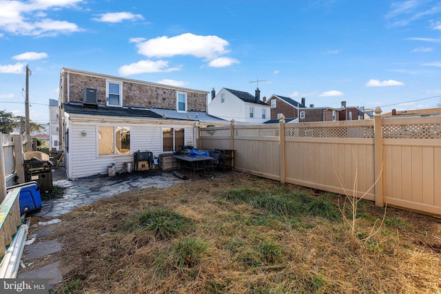 rear view of property featuring central air condition unit