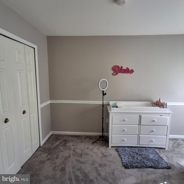 unfurnished bedroom featuring carpet flooring and a closet