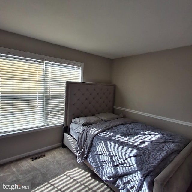 bedroom featuring carpet