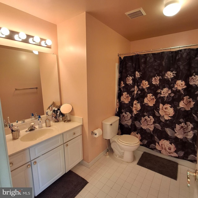 bathroom with tile patterned flooring, vanity, a shower with curtain, and toilet