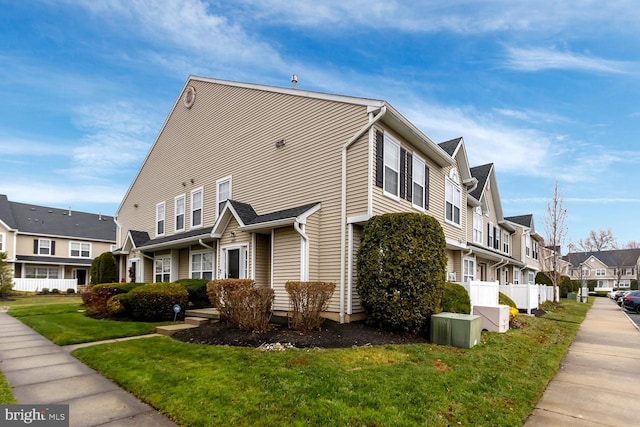 view of property exterior featuring a lawn