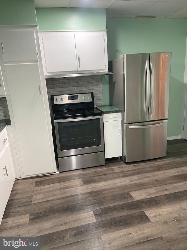 414 Commonwealth Ave, Trenton, NJ 08629 - kitchen featuring stainless steel appliances, white cabinetry, dark wood finished floors, and dark countertops