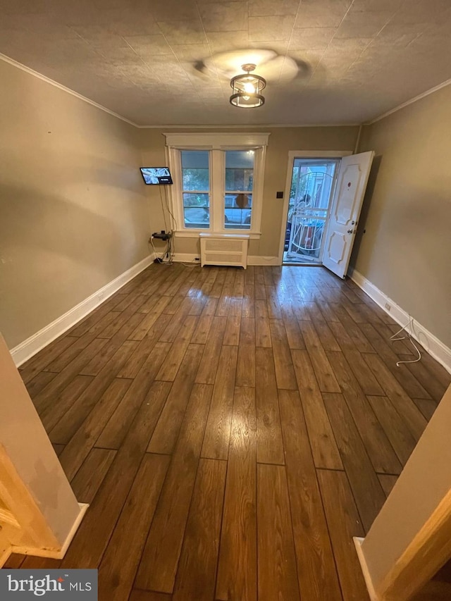 414 Commonwealth Ave, Trenton, NJ 08629 - foyer with dark wood-style floors, ornamental molding, and radiator
