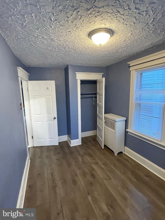 414 Commonwealth Ave, Trenton, NJ 08629 - unfurnished bedroom featuring dark wood-type flooring and a closet