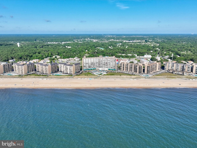 aerial view with a water view and a beach view