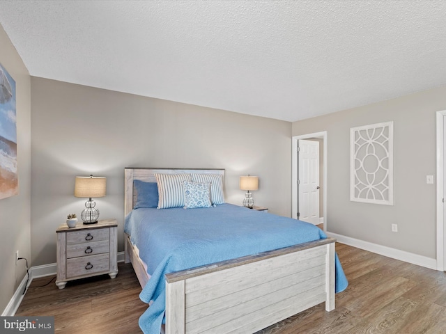 701 S Edgewater House Rd Unit 701S, Bethany Beach, DE 19930 - bedroom featuring wood finished floors and a textured ceiling