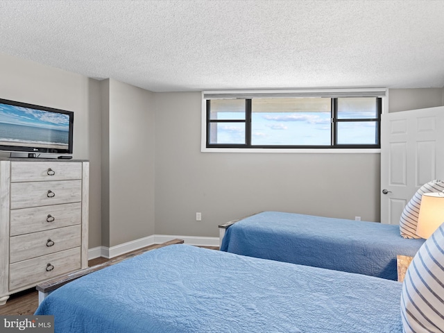 701 S Edgewater House Rd Unit 701S, Bethany Beach, DE 19930 - bedroom featuring wood finished floors and a textured ceiling
