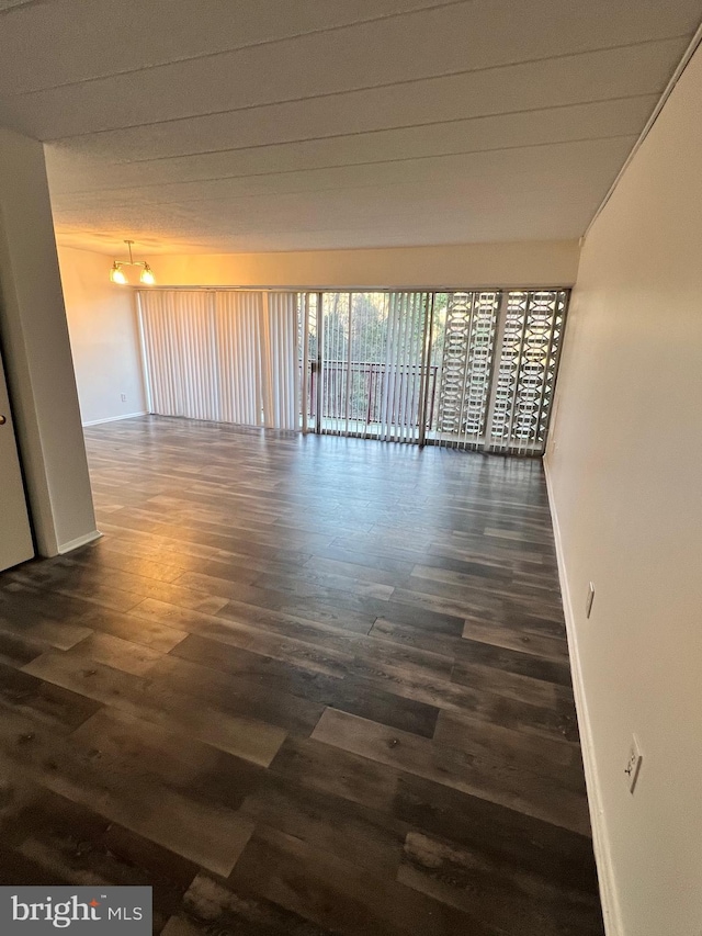 unfurnished room featuring dark hardwood / wood-style floors