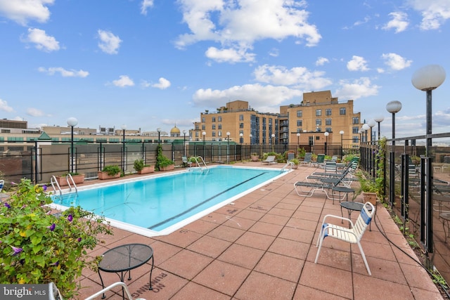 view of pool featuring a patio area