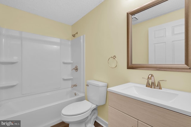 full bathroom featuring bathtub / shower combination, vanity, a textured ceiling, wood-type flooring, and toilet